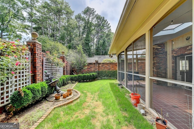 view of yard with a sunroom