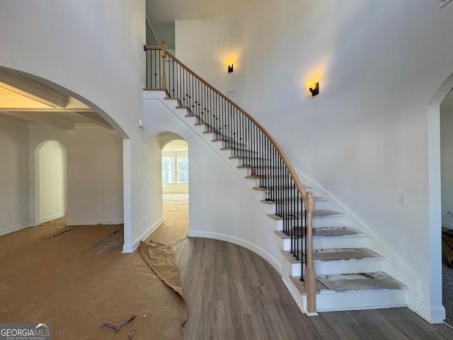 stairway featuring hardwood / wood-style flooring