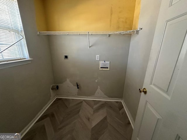 washroom featuring hookup for an electric dryer and parquet floors