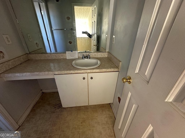 bathroom featuring vanity and tile patterned flooring