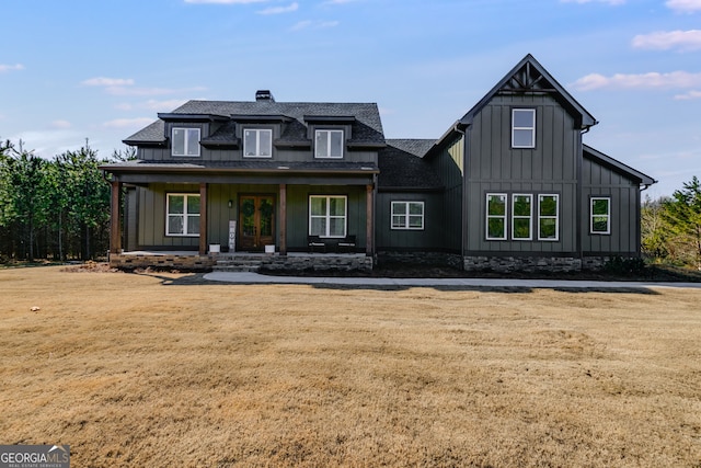 view of front of home featuring a porch and a front lawn