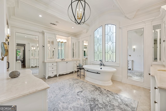 bathroom featuring an inviting chandelier, a bathing tub, tile patterned flooring, ornamental molding, and vanity