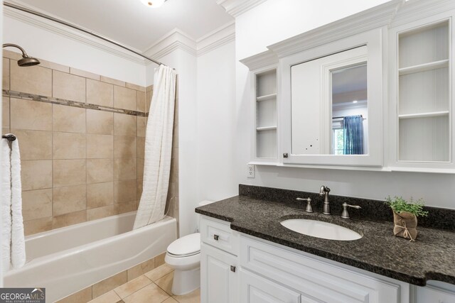 full bathroom with tile patterned flooring, toilet, vanity, ornamental molding, and shower / tub combo with curtain