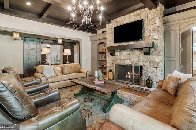 living room with wood ceiling, a fireplace, a chandelier, and beamed ceiling