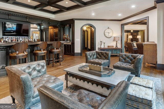 living room with beam ceiling, light hardwood / wood-style flooring, and coffered ceiling