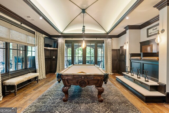 game room with pool table, light wood-type flooring, vaulted ceiling, and crown molding