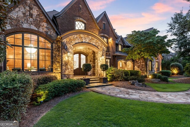 view of front of home with a yard