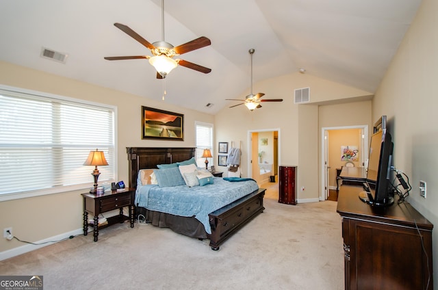 bedroom featuring ceiling fan, vaulted ceiling, and light carpet