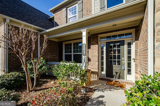 property entrance featuring a porch