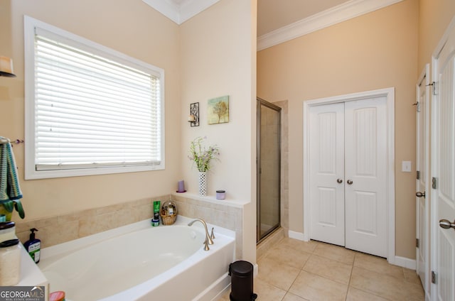 bathroom with tile patterned flooring, crown molding, and shower with separate bathtub