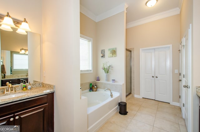 bathroom featuring vanity, tile patterned flooring, crown molding, and plus walk in shower