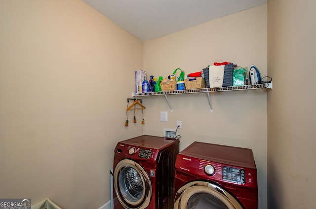 washroom featuring washer and clothes dryer