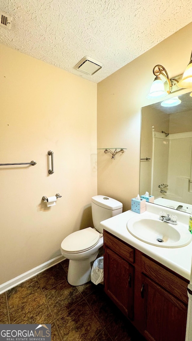 full bathroom with toilet, vanity, tub / shower combination, and a textured ceiling