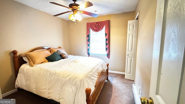 carpeted bedroom with a textured ceiling and ceiling fan