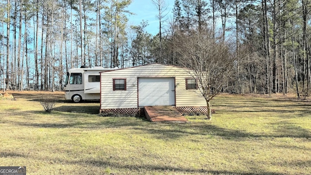 view of outbuilding with a yard