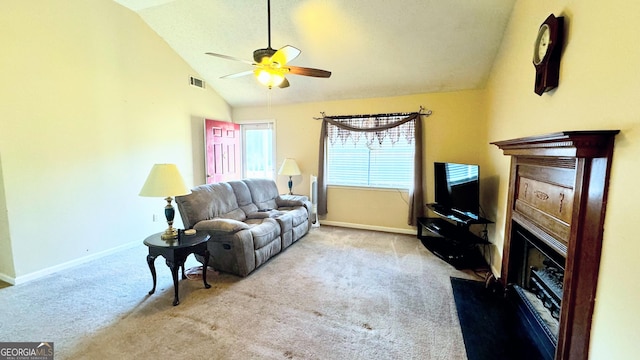 living room featuring light carpet, vaulted ceiling, and ceiling fan