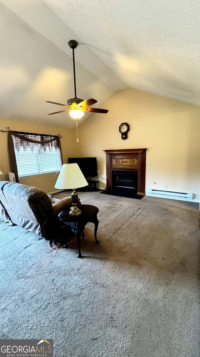 interior space with lofted ceiling, carpet floors, a textured ceiling, ceiling fan, and a baseboard radiator