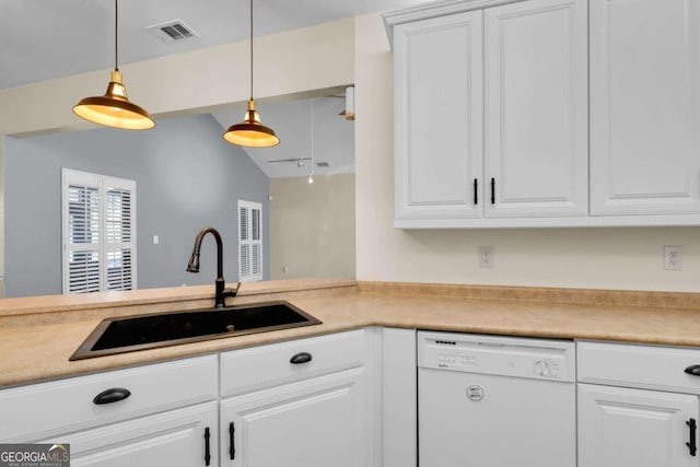 kitchen featuring white dishwasher, decorative light fixtures, and white cabinetry