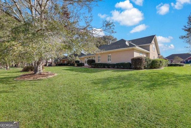 view of home's exterior featuring a yard