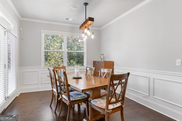 dining area with dark wood-type flooring and crown molding