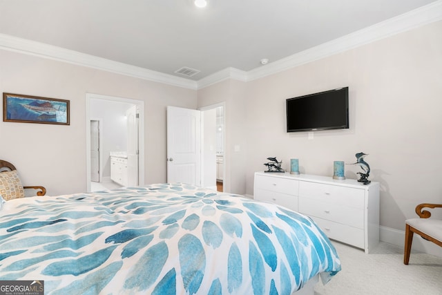 carpeted bedroom with ensuite bath and crown molding