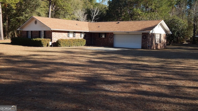 ranch-style home featuring a garage