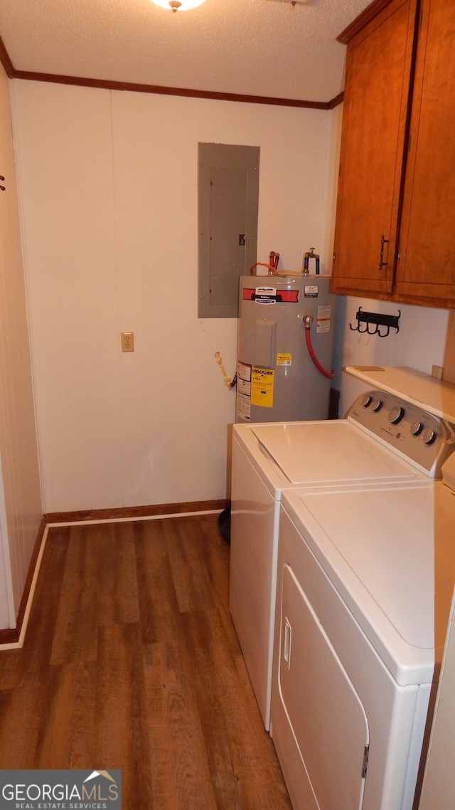 clothes washing area featuring cabinets, electric panel, dark wood-type flooring, water heater, and washer and clothes dryer