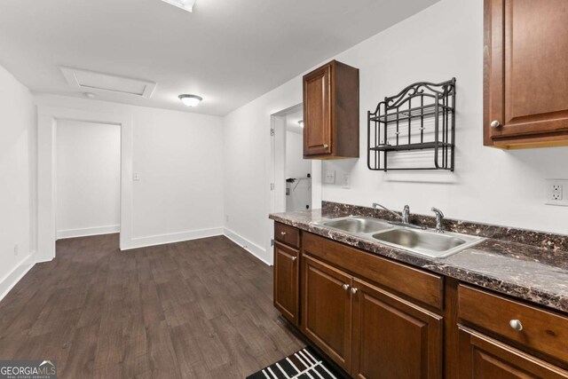 kitchen with sink and dark hardwood / wood-style flooring