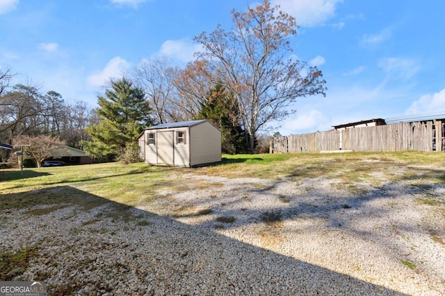 view of yard with a storage unit