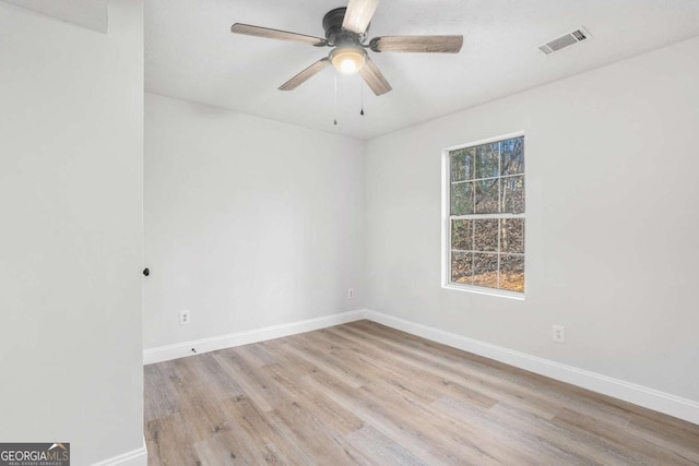 empty room featuring ceiling fan and light hardwood / wood-style flooring