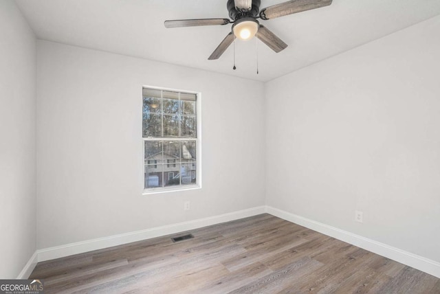 empty room featuring ceiling fan and wood-type flooring