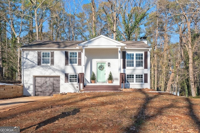 raised ranch featuring a garage