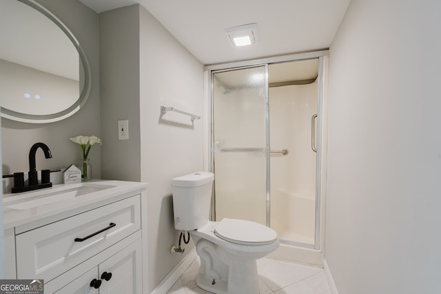 full bathroom with a stall shower, baseboards, toilet, tile patterned floors, and vanity