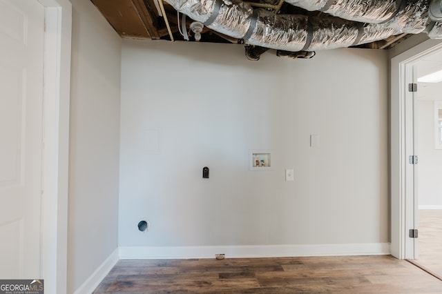 clothes washing area with hookup for a washing machine, hookup for an electric dryer, baseboards, and wood finished floors