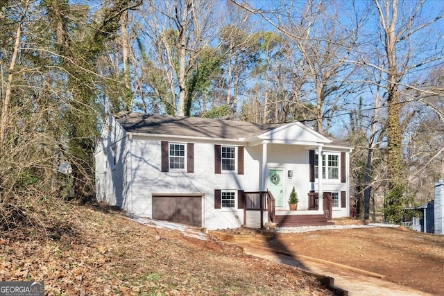 bi-level home featuring a garage