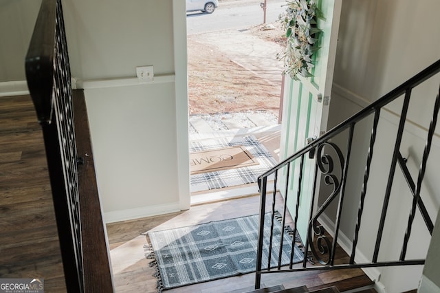 interior space with stairs and baseboards