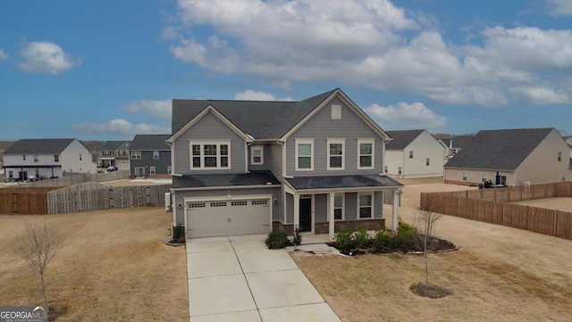 view of front of property with a garage, covered porch, and a front lawn