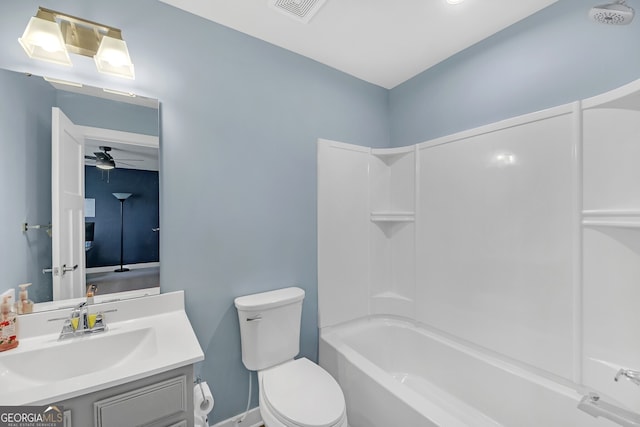 full bathroom featuring toilet, tub / shower combination, ceiling fan, and vanity