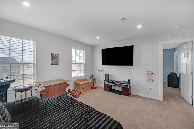 bedroom with light colored carpet