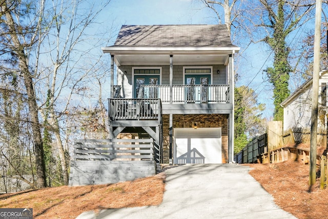 view of front of home featuring covered porch and a garage