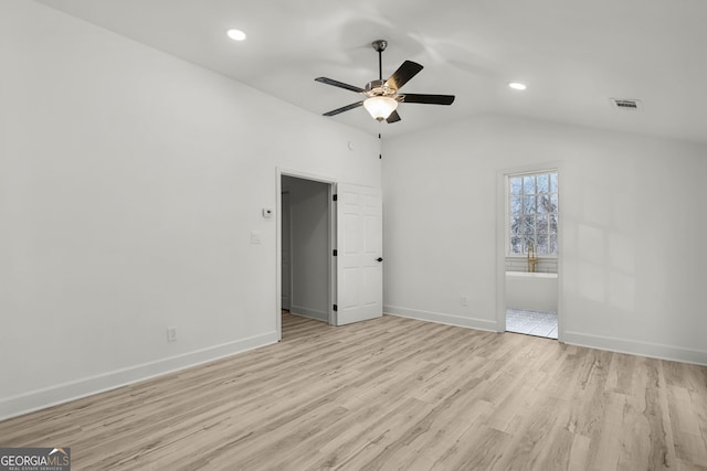 unfurnished bedroom with vaulted ceiling, ceiling fan, and light hardwood / wood-style floors