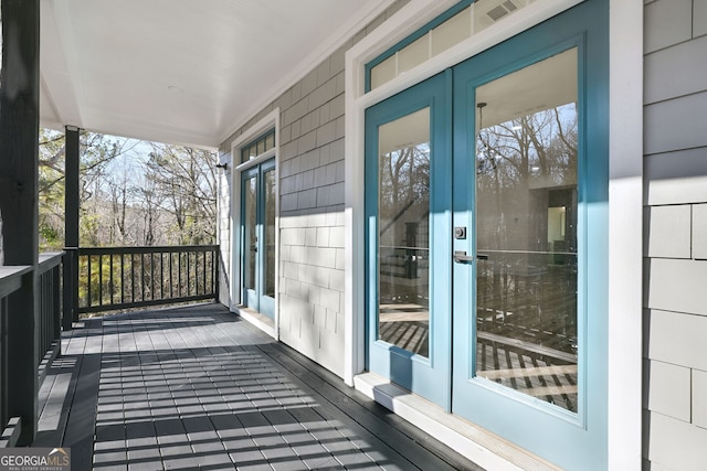 wooden deck featuring french doors