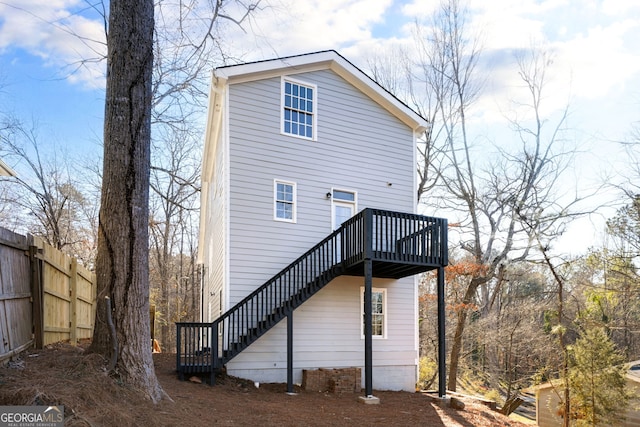 back of property with a wooden deck