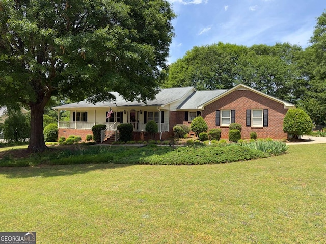 114 Tracy Ln, Mcdonough, GA 30253 - ranch-style house featuring covered porch, brick siding, and a front lawn