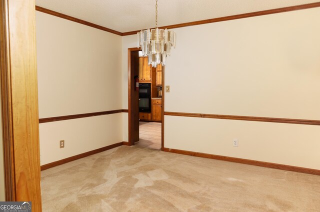 114 Tracy Ln, Mcdonough, GA 30253 - spare room with light colored carpet, crown molding, baseboards, and a chandelier