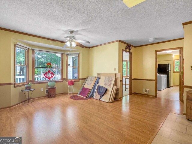 playroom with ceiling fan, ornamental molding, and light hardwood / wood-style flooring