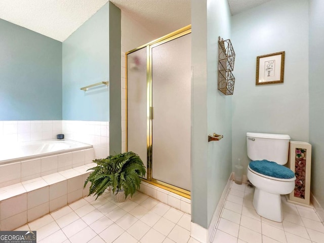 114 Tracy Ln, Mcdonough, GA 30253 - bathroom with tile patterned floors, a stall shower, a bath, and a textured ceiling