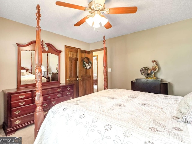 bedroom with light carpet, a textured ceiling, and ceiling fan