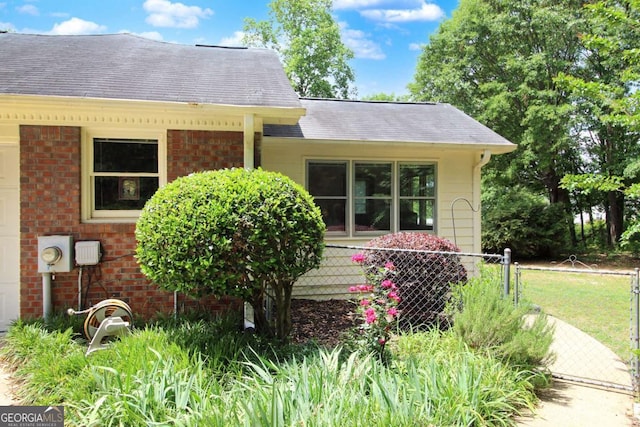 114 Tracy Ln, Mcdonough, GA 30253 - view of front of house featuring a shingled roof and brick siding
