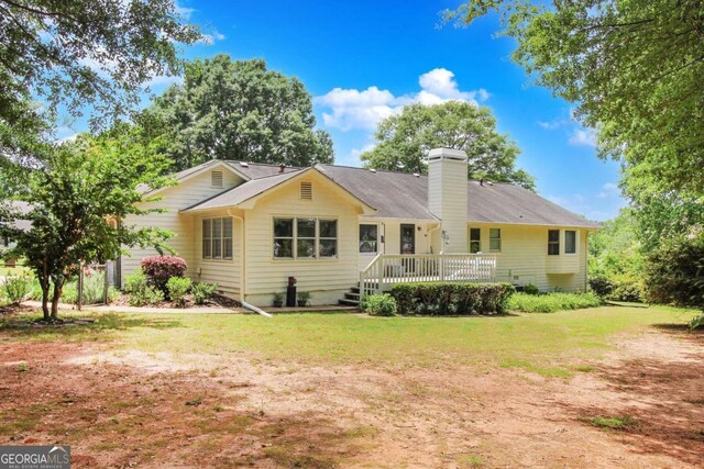 114 Tracy Ln, Mcdonough, GA 30253 - back of house with a chimney and a yard